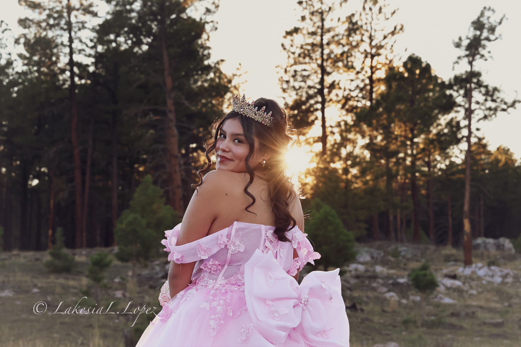 Portrait in a pink dress at sunset